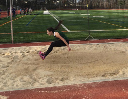 Kunstler attempting the long jump at a track meet this year. 