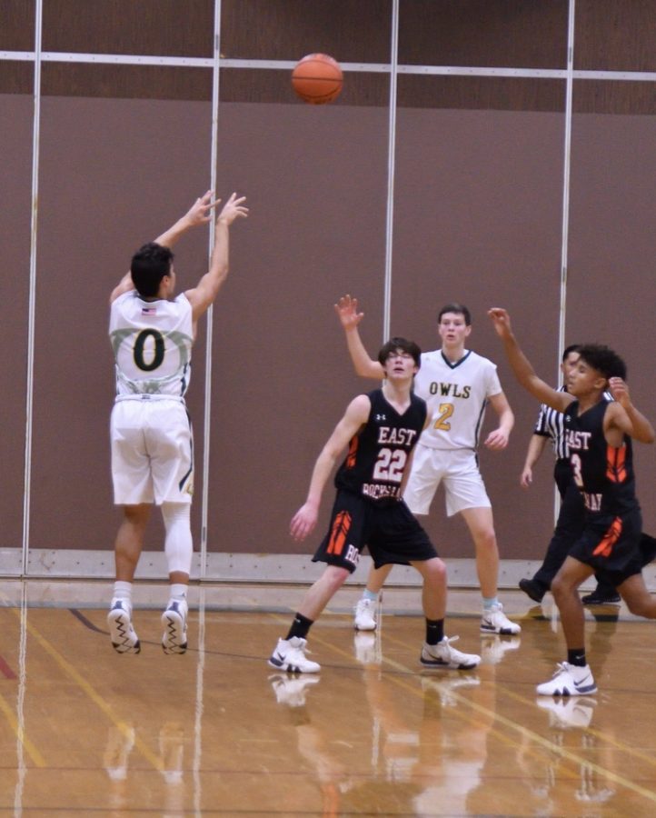 Rylan Blondo (0) takes a shot from beyond the arch.