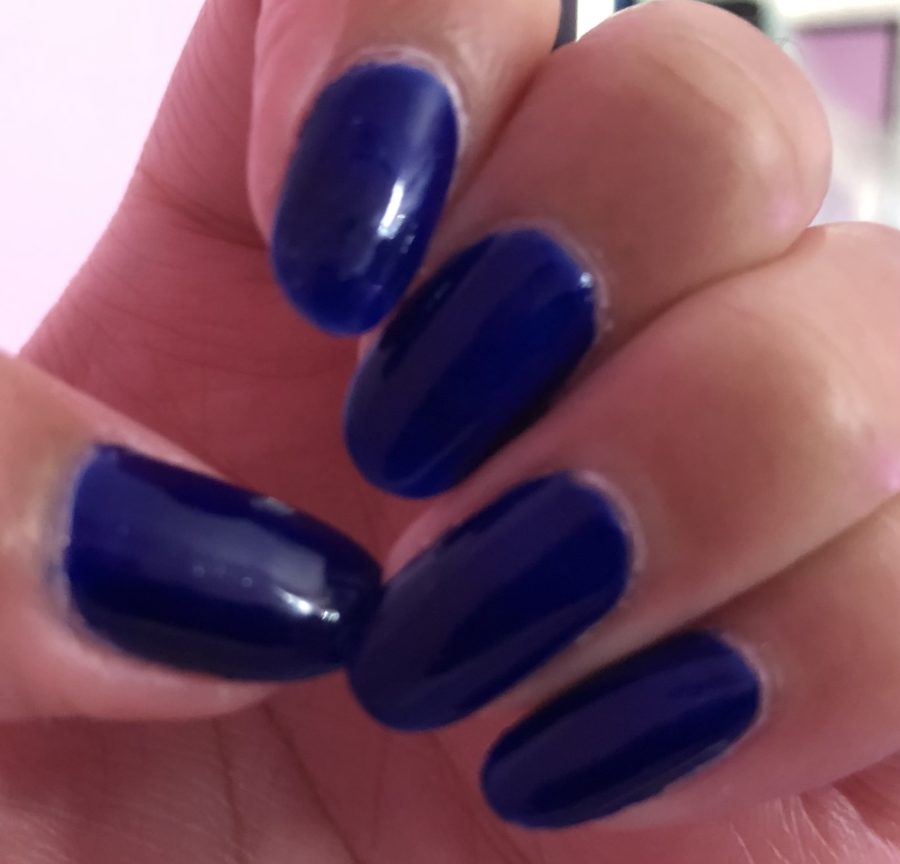 Blue nails by Alexis Sooklall