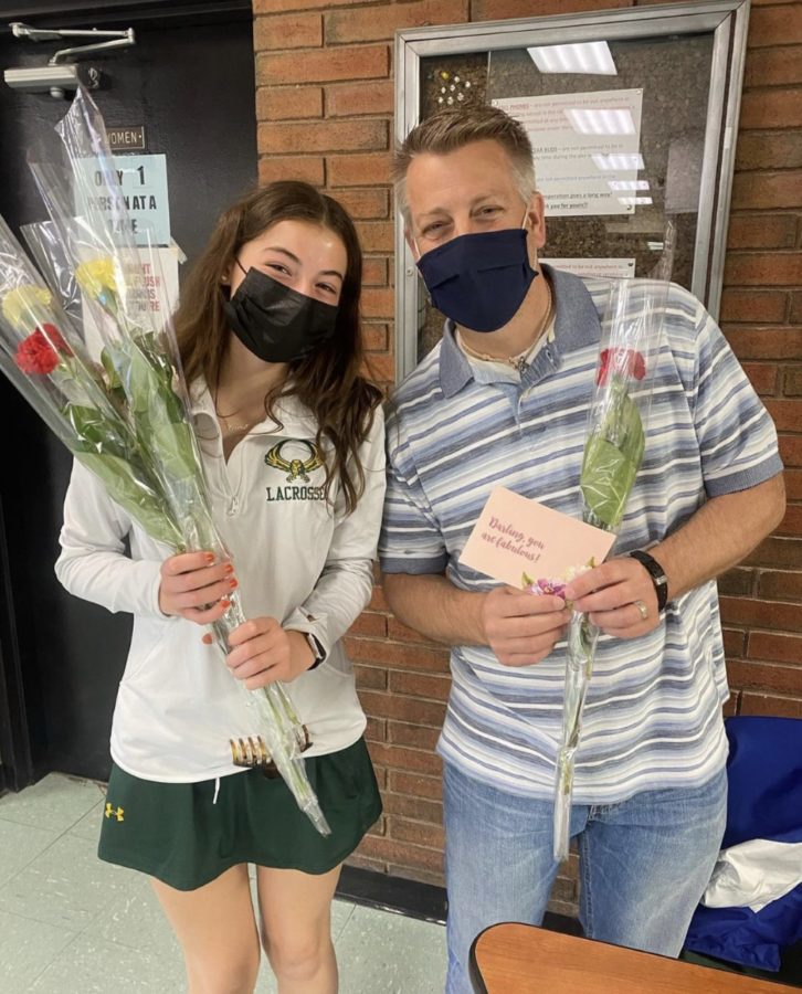 Emma Leighley presents teacher Michael Spinella with flowers for Teacher Appreciation Week.