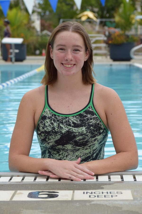 Kane smiles for her LHS Varsity Swim Team photo