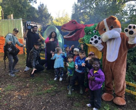 Children pose with costumed volunteers at CSTLs Spooky Fest