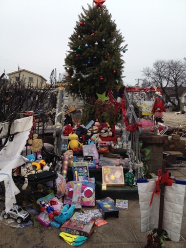 A Christmas tree and gifts put up in Breezy Point.