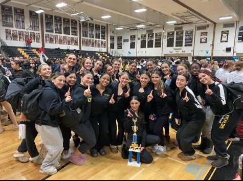 Varsity kickline members pose with a trophy at a recent competition -Courtesy of Alexis Raynor