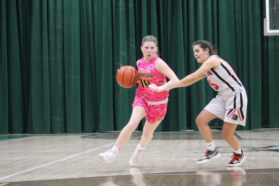 Senior Kaelynn OBrien drives against a Floral Park defender in the first half of Tuesdays game. OBrien added 5 points in the win over the Knights.