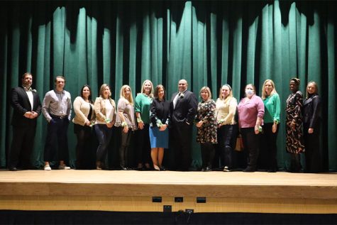 The Founders Day honorees pose on the auditorium stage