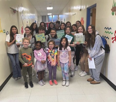 Club members with Kindergarten Center students after reading to them