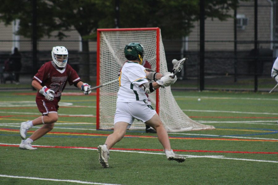 Senior Max Dantona winds up for a shot against Mephams goalie. Dantona ended the game with a hat trick in Lynbrooks 14-8 win.