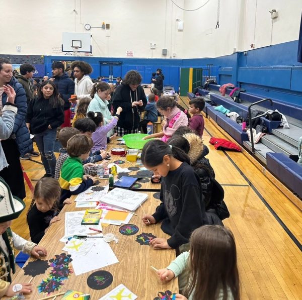 Marion Street students play with cultural crafts. Photo Courtesy of @lhsdiversityclub Instagram page.