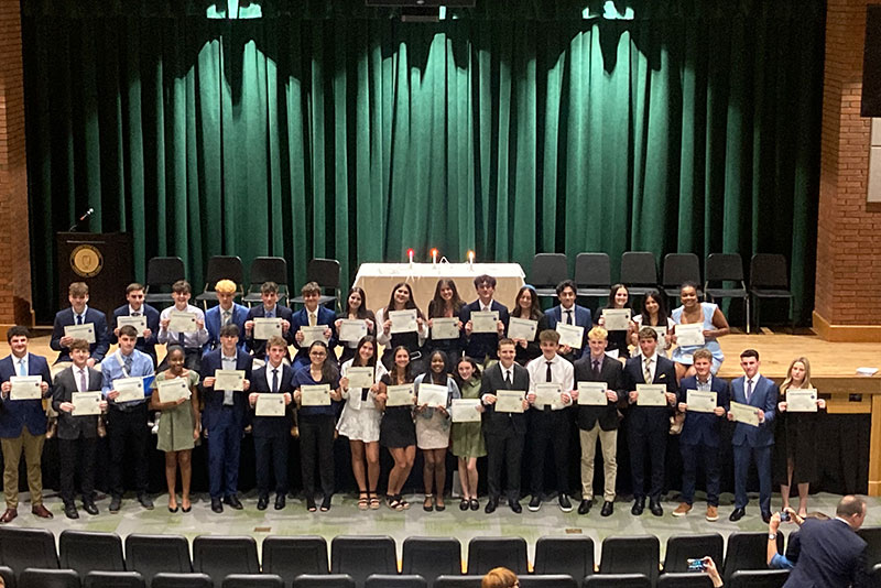 The+new+inductees+pose+with+their+certificates+after+the+ceremony.+Photo+Courtesy+of+Lynbrook+Schools+page.