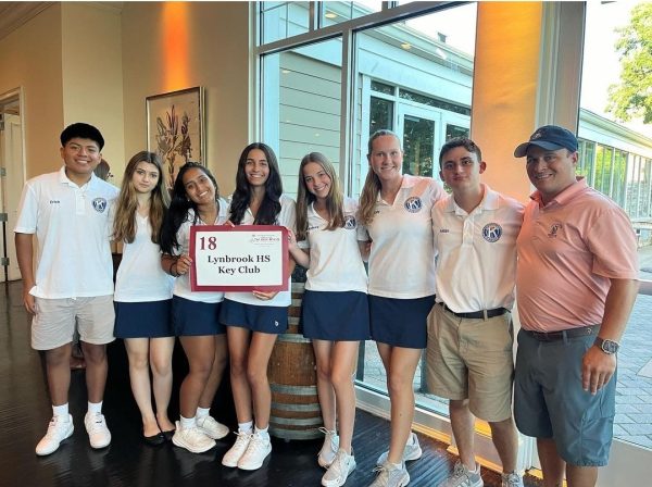 Key Club members pose for a photo with Club Advisor Dr. Tieniber [far right] at Stonebridge Country Club. Photo Courtesy of @lhstieiber Instagram page. 