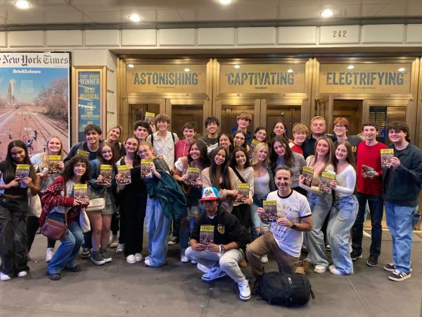 Choir students huddle in front of Bernard B. Jacobs Theatre for a photo. Photo courtesy of Barry Wyner