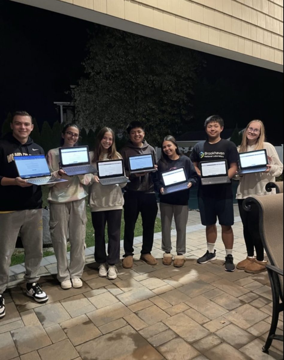 Seniors pose for a picture after submitting their applications.