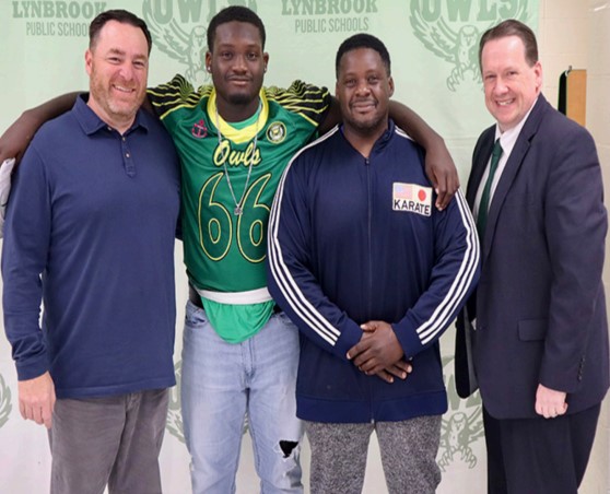 (L-R) Board of Education Trustee Mr. 
Palleschi, McClean, McClean’s father, and Dr. Lynch.
Photo courtesy of Lynbrook Public Schools Website