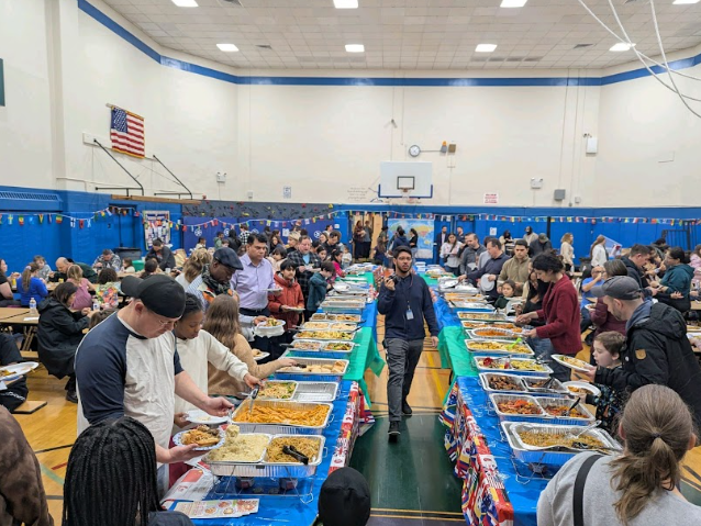 Marion Street’s gymnasium full of food from various cultures and countries. Photo courtesy of Joshua Schulman