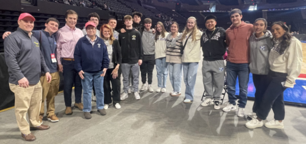 Group photo with
students at the game. Photo courtesy of Benedict Tieniber