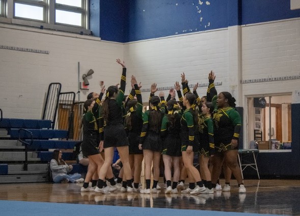 Varsity cheer getting psyched at 
their Saturday, Jan. 25 meet